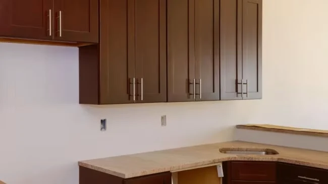 Wood wall cabinets above a light countertop