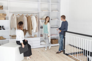 Dallas No.1 Custom Closets vs Modular Closet Systems long shot couple looking through dressing scaled.jpg